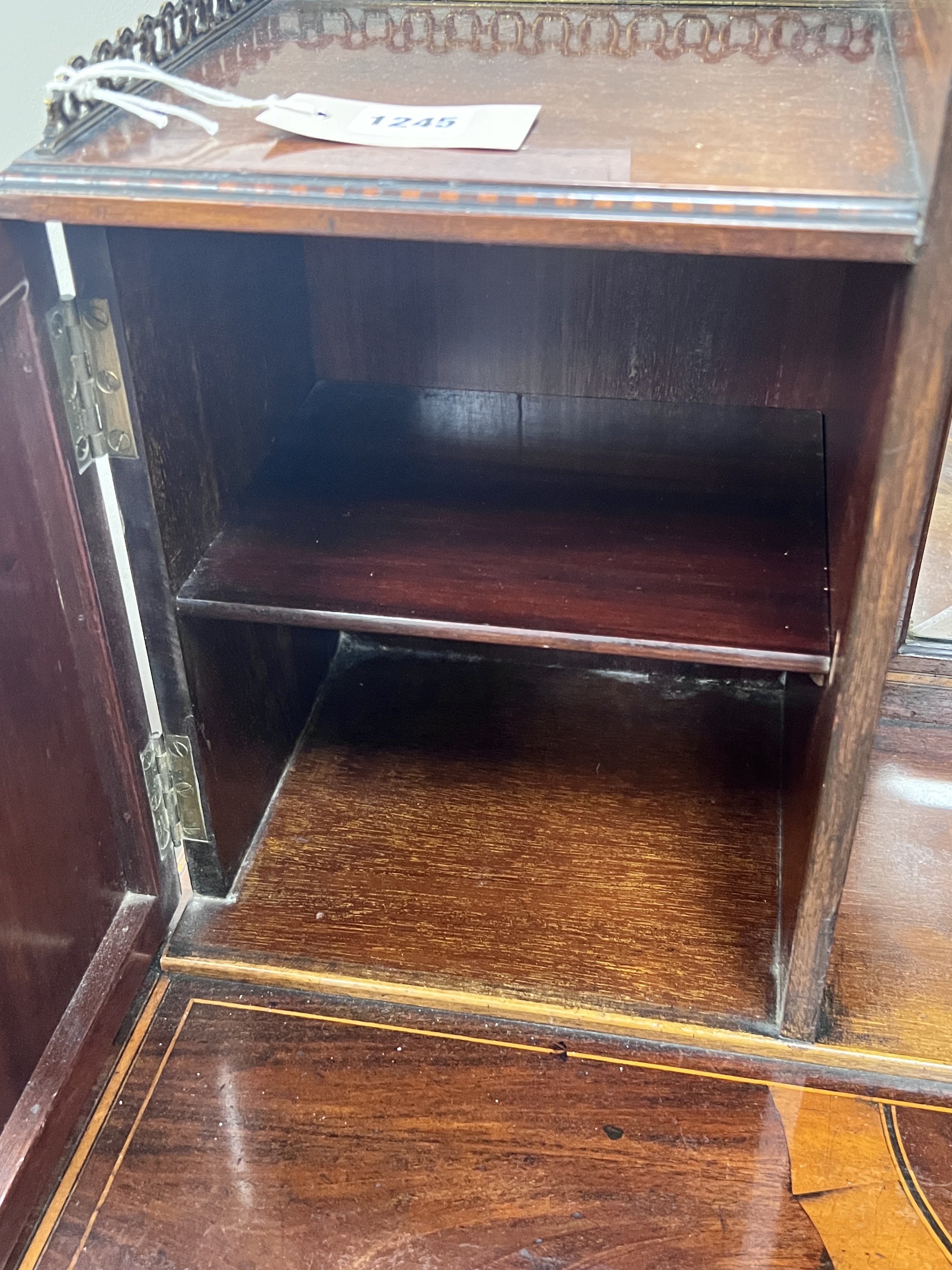 An Edwardian marquetry inlaid mahogany bonheur du jour, in the manner of Edwards & Roberts, width 92cm, depth 52cm, height 118cm